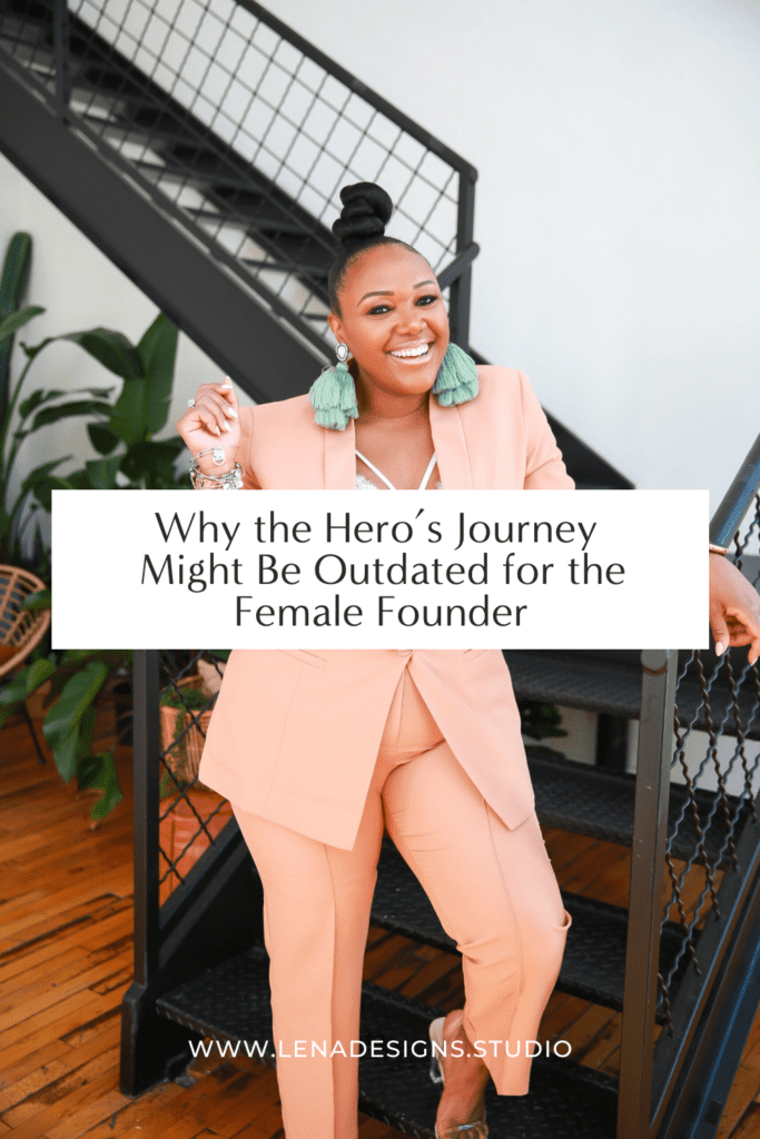 Vibrant black business owner smiling in front of a staircase in a peach suit behind text that reads Why the hero's journey might be outdated for the female founder".